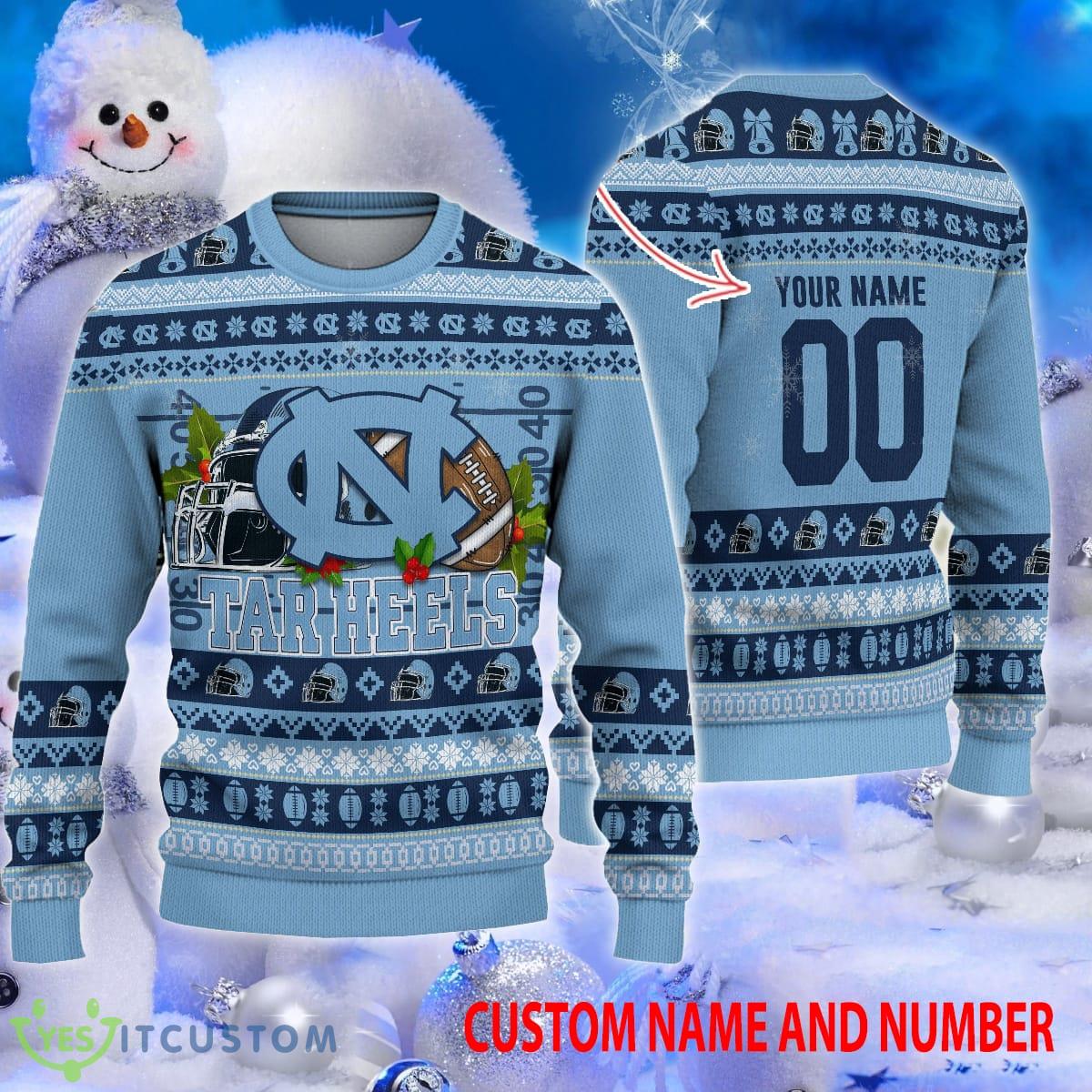 NCAA Merry Christmas North Carolina Tar Heels Helmet Rugby Ball Ugly Sweater Custom Number And Name 3 NCAA Merry Christmas North Carolina Tar Heels Helmet Rugby Ball Ugly Sweater Custom Number And Name - NCAA Merry Christmas North Carolina Tar Heels Helmet Rugby Ball Ugly Sweater Custom Number And Name