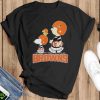 Official peanuts Charlie Brown Snoopy And Woodstock Cleveland Browns Walking 2023 Shirt - Black T-Shirt